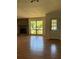 Living room featuring stone fireplace and natural light at 1804 Sw 29Th Ter, Ocala, FL 34474