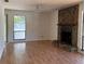 Bright living room with stone fireplace and large window at 1804 Sw 29Th Ter, Ocala, FL 34474