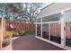 View of the backyard with the sunroom attached to the house at 2145 Ne 45Th Ave # 2145, Ocala, FL 34470