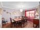 Elegant dining room with a chandelier, large table with seating for eight, and ample natural light at 2145 Ne 45Th Ave # 2145, Ocala, FL 34470