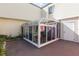 Exterior view of the sunroom addition with access to the home and backyard at 2145 Ne 45Th Ave # 2145, Ocala, FL 34470