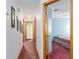 Well-lit hallway with multiple doorways, seamlessly connecting various rooms within the home at 2145 Ne 45Th Ave # 2145, Ocala, FL 34470