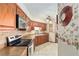 Traditional-style kitchen featuring warm wood cabinetry, tile backsplash, and stainless steel appliances at 2145 Ne 45Th Ave # 2145, Ocala, FL 34470