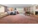 Spacious living room featuring a piano, fireplace, and ample seating area at 2145 Ne 45Th Ave # 2145, Ocala, FL 34470