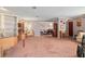 Open floor plan with a grand piano seamlessly connecting the living room, dining area, and kitchen at 2145 Ne 45Th Ave # 2145, Ocala, FL 34470
