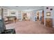 Spacious living room features a fireplace, built-in bookshelves, and grand piano at 2145 Ne 45Th Ave # 2145, Ocala, FL 34470