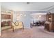 Open floor plan with a grand piano seamlessly connecting the living room, dining area, and kitchen at 2145 Ne 45Th Ave # 2145, Ocala, FL 34470