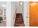 Carpeted staircase leading to the upper level, offering a seamless transition between floors at 2145 Ne 45Th Ave # 2145, Ocala, FL 34470