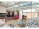 Sunroom with a view into the dining room and access to the backyard at 2145 Ne 45Th Ave # 2145, Ocala, FL 34470