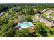 Aerial view of community, including homes, tennis court, and pool at 2321 Se 19Th Cir, Ocala, FL 34471