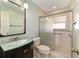 Updated bathroom with glass shower and modern vanity at 2321 Se 19Th Cir, Ocala, FL 34471