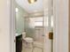 Clean bathroom with glass shower door and updated vanity at 2321 Se 19Th Cir, Ocala, FL 34471