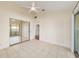 Bright bedroom with tile floors, mirrored closet doors, and access to other rooms at 2321 Se 19Th Cir, Ocala, FL 34471