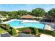Large community pool with surrounding landscaping and a clubhouse at 2321 Se 19Th Cir, Ocala, FL 34471
