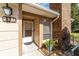 Condo entrance with a white door and brick accent wall at 2321 Se 19Th Cir, Ocala, FL 34471