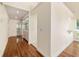 Hardwood floor hallway with access to bathroom at 2321 Se 19Th Cir, Ocala, FL 34471