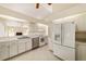 Modern kitchen with stainless steel appliances and white cabinets at 2321 Se 19Th Cir, Ocala, FL 34471