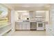 Eat-in kitchen with white cabinets and stainless steel appliances at 2321 Se 19Th Cir, Ocala, FL 34471