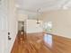 Spacious living room with hardwood floors, a fireplace, and vaulted ceilings at 2321 Se 19Th Cir, Ocala, FL 34471