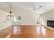 Bright living room featuring hardwood floors, a fireplace and large windows at 2321 Se 19Th Cir, Ocala, FL 34471