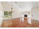 Living room with hardwood floors, fireplace and chandelier at 2321 Se 19Th Cir, Ocala, FL 34471