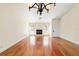 Living room with hardwood floors, a fireplace and chandelier at 2321 Se 19Th Cir, Ocala, FL 34471