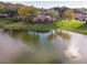 Serene pond with fountain, reflecting community clubhouse at 2321 Se 19Th Cir, Ocala, FL 34471