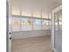 Sunroom featuring large windows, blinds, and light flooring at 2321 Se 19Th Cir, Ocala, FL 34471