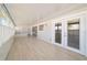 Sunroom addition with light wood flooring and large windows at 2321 Se 19Th Cir, Ocala, FL 34471