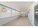 Bright sunroom with multiple windows and light-colored flooring at 2321 Se 19Th Cir, Ocala, FL 34471