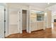 Wet bar with mirrored backsplash and open shelving at 2321 Se 19Th Cir, Ocala, FL 34471