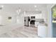 Open concept kitchen with stainless steel appliances and granite countertops at 24025 Nw Foxglove Lane, Dunnellon, FL 34431