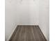 Walk-in closet with wire shelving and wood-look floor at 26 Spring Cir, Ocala, FL 34472