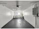 Spacious garage featuring a laundry area with washer and dryer, plus utility sink and water heater at 26 Spring Cir, Ocala, FL 34472