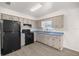 Well-lit kitchen with appliances, double basin sink and wood-look flooring at 26 Spring Cir, Ocala, FL 34472