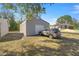 Large metal storage shed sitting on a gravel bed at 26 Spring Cir, Ocala, FL 34472