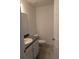 Clean and simple bathroom with a single vanity, toilet, and tile floor at 316 Nw Narcissus Rd, Dunnellon, FL 34431