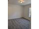 Spacious bedroom with gray carpeting and a large window at 316 Nw Narcissus Rd, Dunnellon, FL 34431