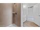 Modern bathroom featuring a tiled walk-in shower with a white vanity and light wood-look flooring at 3212 Ne 46Th Ave, Ocala, FL 34470
