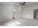 Comfortable bedroom featuring neutral walls, carpet, ceiling fan, and ample closet space at 3212 Ne 46Th Ave, Ocala, FL 34470