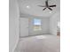 Cozy bedroom featuring neutral walls, carpet, and a window with a view of the outdoors at 3212 Ne 46Th Ave, Ocala, FL 34470