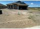 Charming single-story home with a covered entrance and an attached two-car garage awaiting landscaping at 3212 Ne 46Th Ave, Ocala, FL 34470