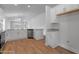 Spacious kitchen featuring white cabinets, stainless steel appliances, and a large island with granite countertops at 3212 Ne 46Th Ave, Ocala, FL 34470