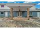 Covered patio with brick columns and ceiling fan at 4301 Se 38Th St, Ocala, FL 34480