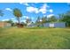 Large backyard with detached garage and sheds at 4301 Se 38Th St, Ocala, FL 34480