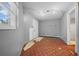 Unfinished basement with exposed walls and damaged flooring at 4301 Se 38Th St, Ocala, FL 34480