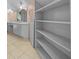 Bathroom with double vanity and built-in shelving at 4301 Se 38Th St, Ocala, FL 34480