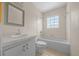 Clean bathroom with a bathtub, toilet and vanity at 4301 Se 38Th St, Ocala, FL 34480
