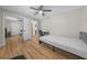 Cozy bedroom with mirrored closet doors and wood-look flooring at 4301 Se 38Th St, Ocala, FL 34480