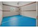 Spacious bedroom with blue carpet, ceiling fan, and a window at 4301 Se 38Th St, Ocala, FL 34480